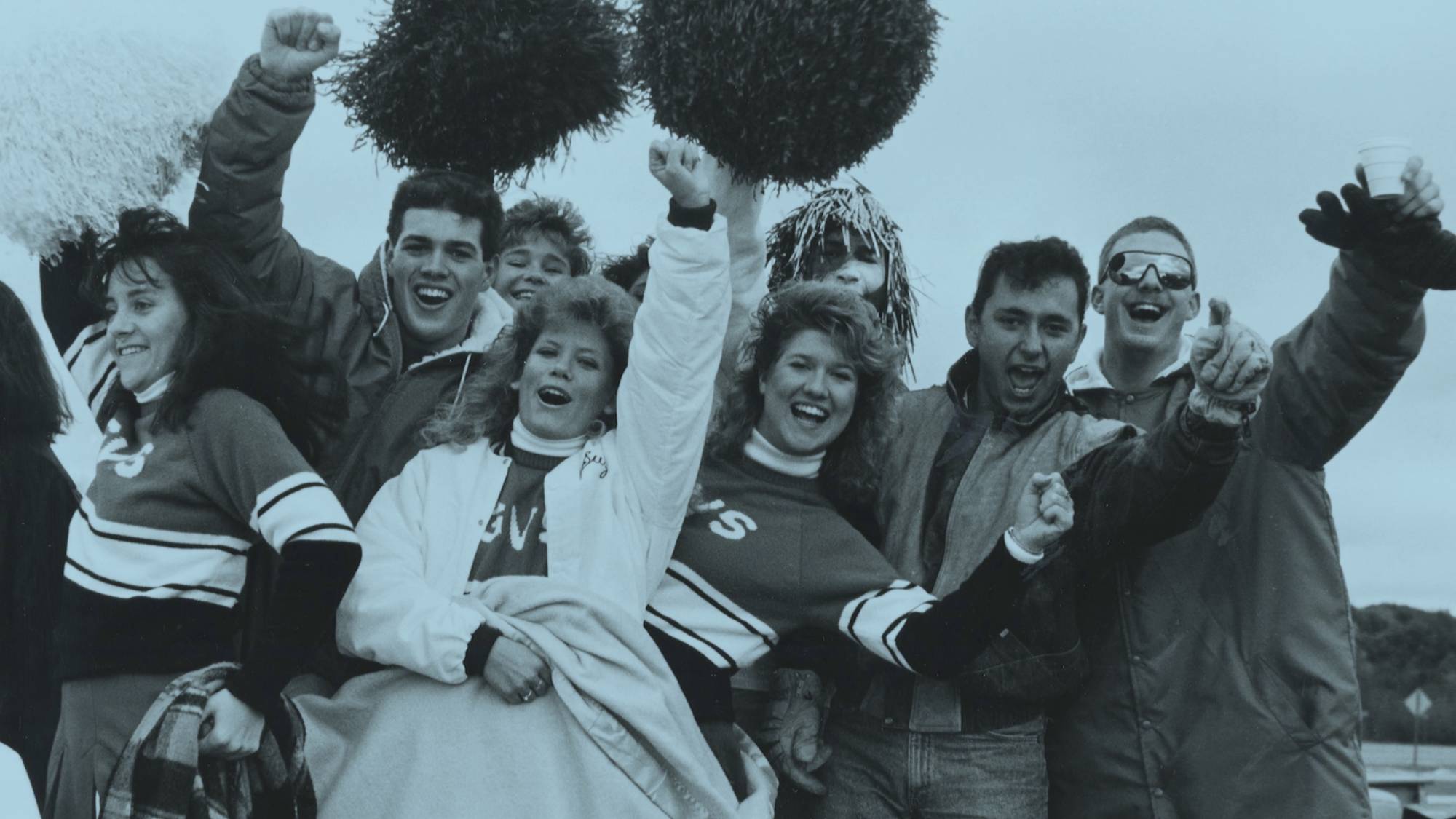 Lakers cheer during a Homecoming tailgate